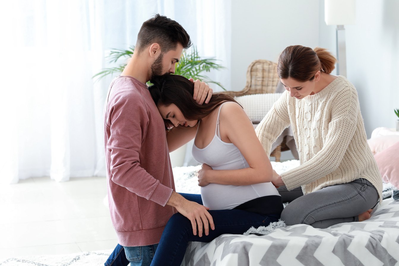 Pregnant Couple with Doula at Home